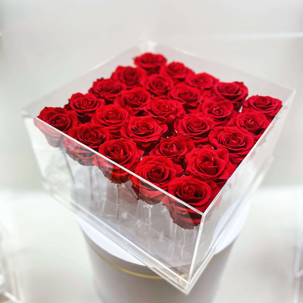 TWENTY FIVE PRESERVED ROSES IN ACRYLIC BOX