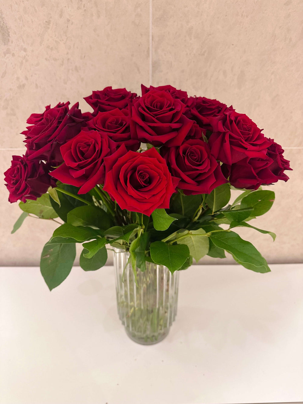 THREE DOZEN ROSES IN A VASE