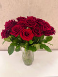 TWO DOZEN ROSES IN A VASE